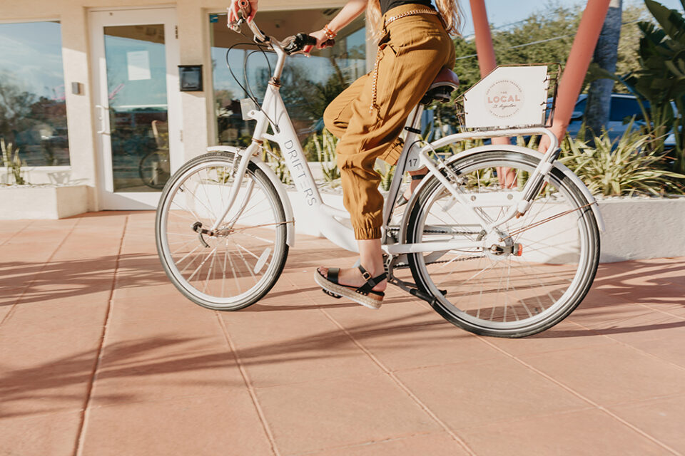 A guest riding bike rental offered by The Local - St. Augustine